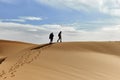 Barkhans of the Sahara desert. Tent in the sand. People in the desert